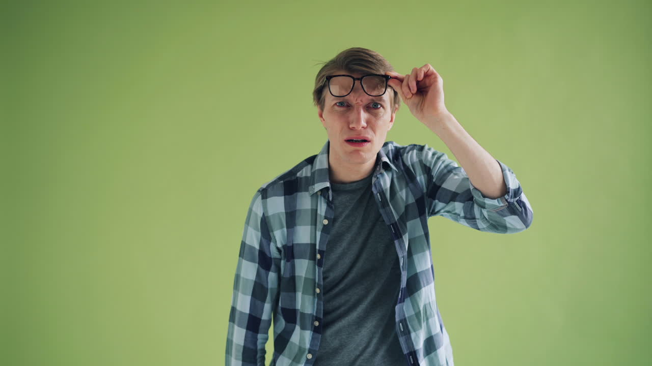 Man wearing glasses with a surprised expression