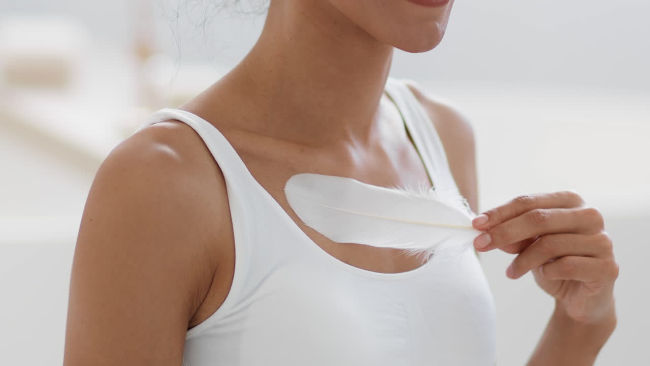 Woman holding a feather
