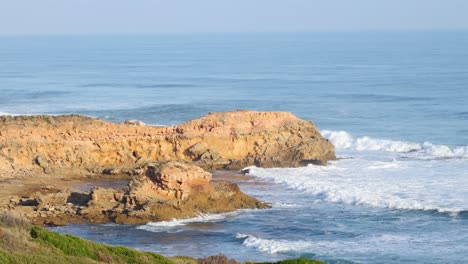 ocean waves hitting rocks at mornington peninsula