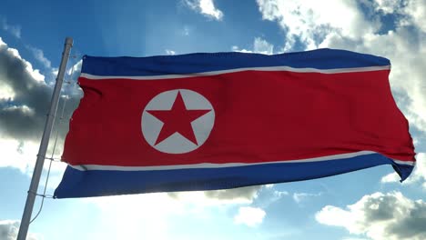 la bandera de corea del norte ondeando en el viento contra el cielo azul profundo. tema nacional, concepto internacional