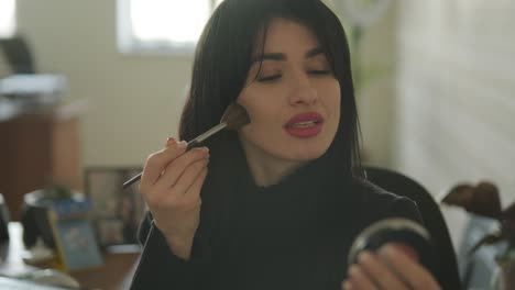 professional businesswoman in her office applying makeup, dressed in elegant business attire, balancing personal care and work responsibilities in a modern office setting