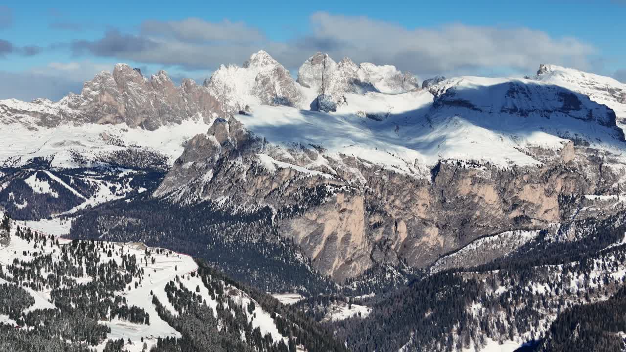 Raw rock formation in the Italian Dolomites during winter season (drone footage)