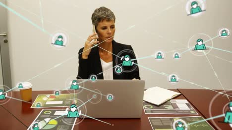 Animation-of-network-of-profile-icons-over-caucasian-businesswoman-talking-on-smartphone-at-office