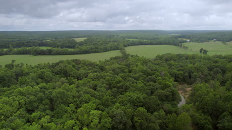 Boom-up-over-beautiful-country-landscape-in-southern-Missouri-on-a-cloudy-summer-day