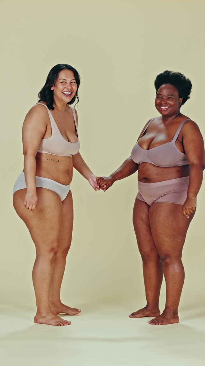 Two women in lingerie celebrating body positivity and friendship