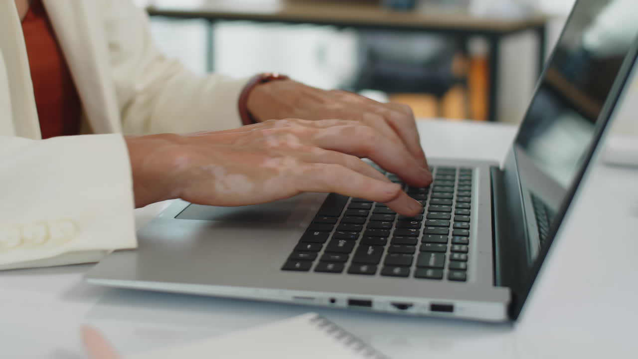 Hands of Female Entrepreneur Typing on Laptop
