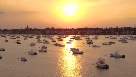 big yellow sun sunset at marblehead harbor full of yachts, essex county