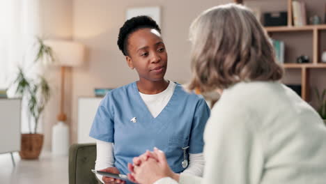 nurse consulting with elderly patient