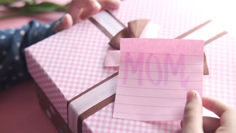 child giving gift to mom for mother's day