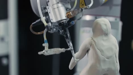 exploring the intricacies of robotic manipulation: a close-up on the precision and detail of robotic systems interacting with a sculpted model