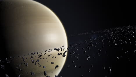 toma cinematográfica de saturno y asteroides o rocas en órbita del anillo