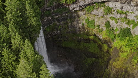 Brandywine-Falls-BC-Canada-Aerial-v5-cinematic-reveal-zoomed-shot,-drone-flyover-provincial-park-capturing-majestic-waterfall-cascading-into-deep-rocky-canyon---Shot-with-Mavic-3-Pro-Cine---July-2023