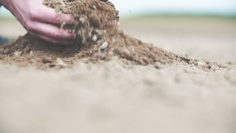 farmer holding soil in hands