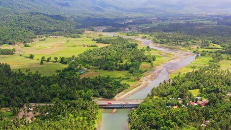 stunning countryside with bridge over river along with lush forest trees near saint bernard province of southern leyte, philippines