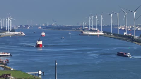 canal with wind turbines and ships