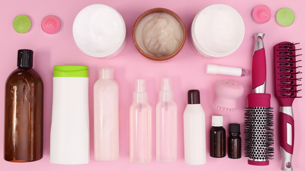 Skin care cosmetics products move on pink theme. Stop motion