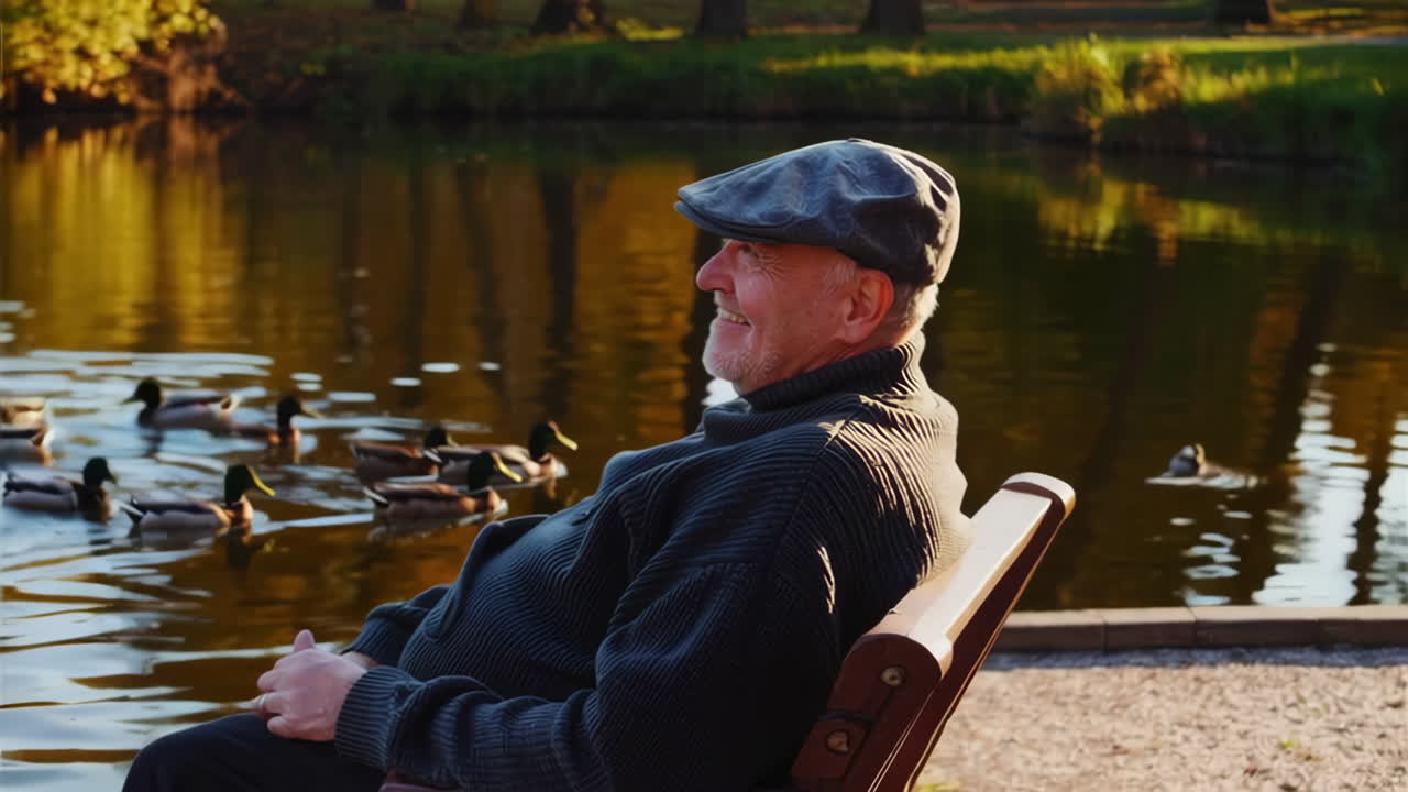 Senior Man Relaxing by a Pond in the Park