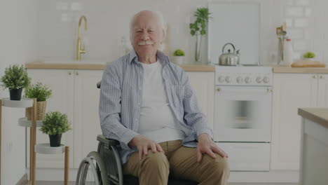 senior man in wheelchair in kitchen