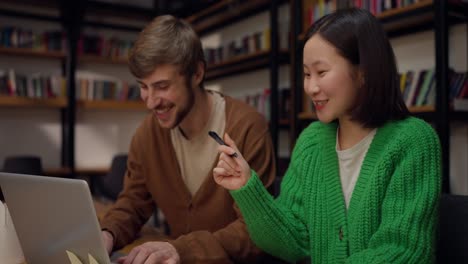 colleagues working together in a library