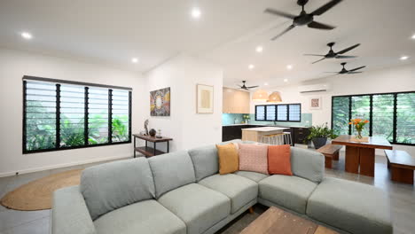 Contemporary open plan lounge room in tropical architecturally designed home