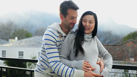 happy couple feeling the presence of baby in stomach 4k