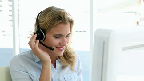 casual call centre worker working at her desk