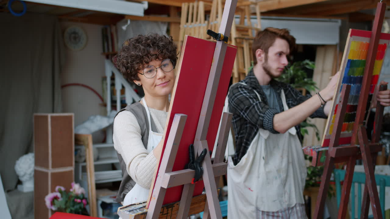 Artists painting in an art studio