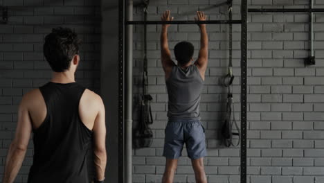 men working out with medicine ball in gym