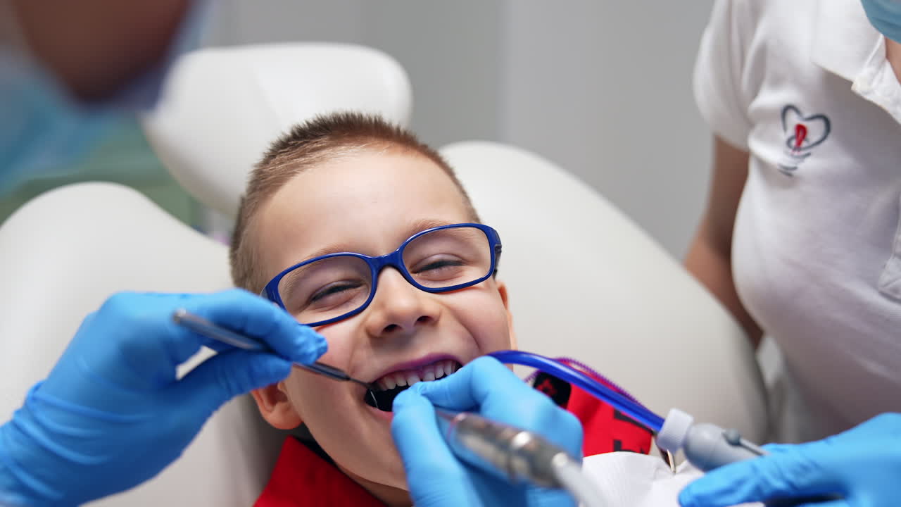 Boy Having Teeth Cleaning at the Dentist