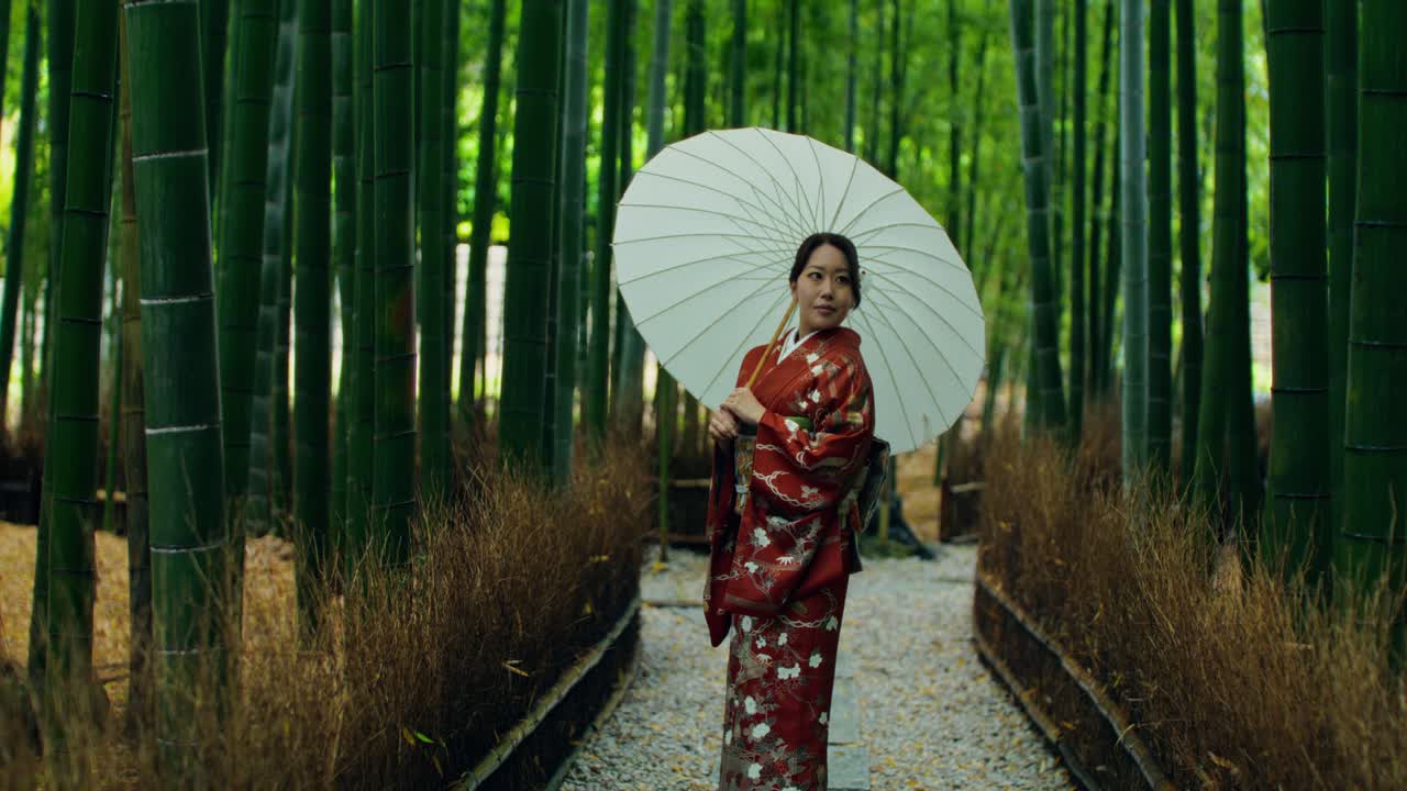 Woman in Kimono in a Bamboo Forest