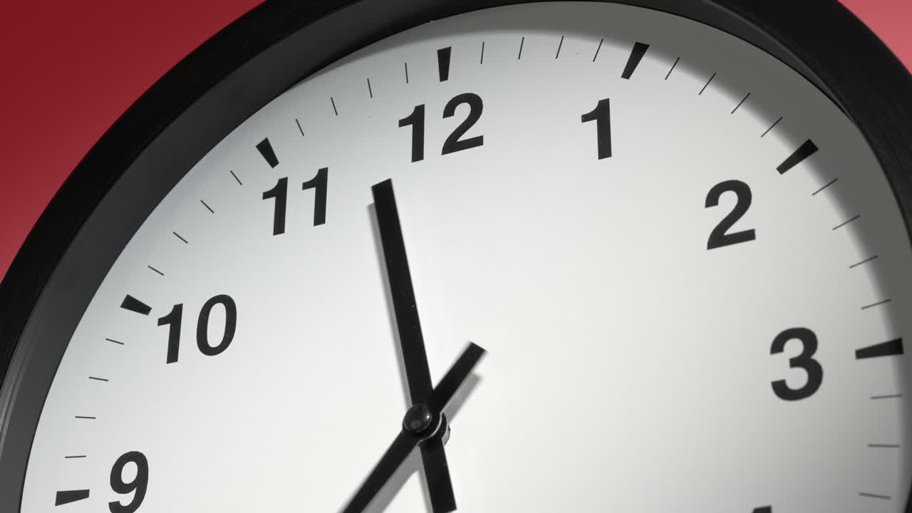 Clock Face on Burgundy Cherry Red Wall in Time Lapse