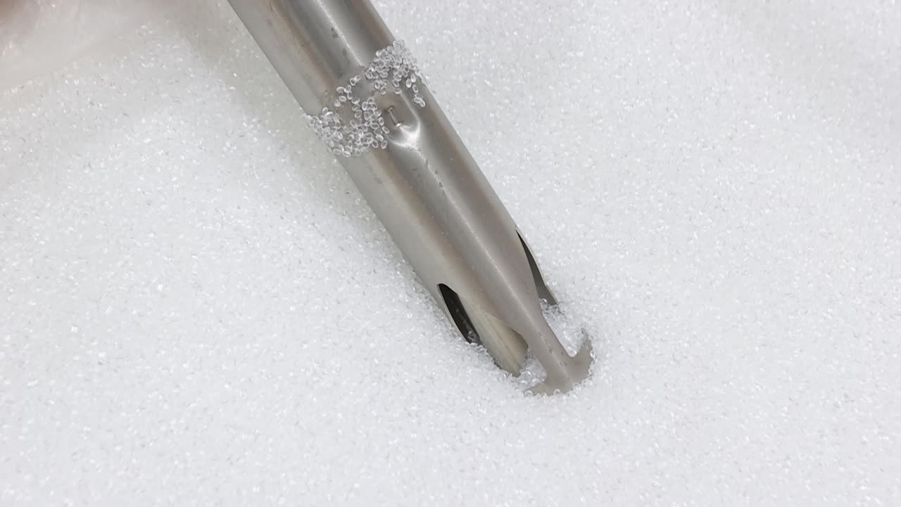 Cinematic view of plastic grains automatically pulled for EVA films