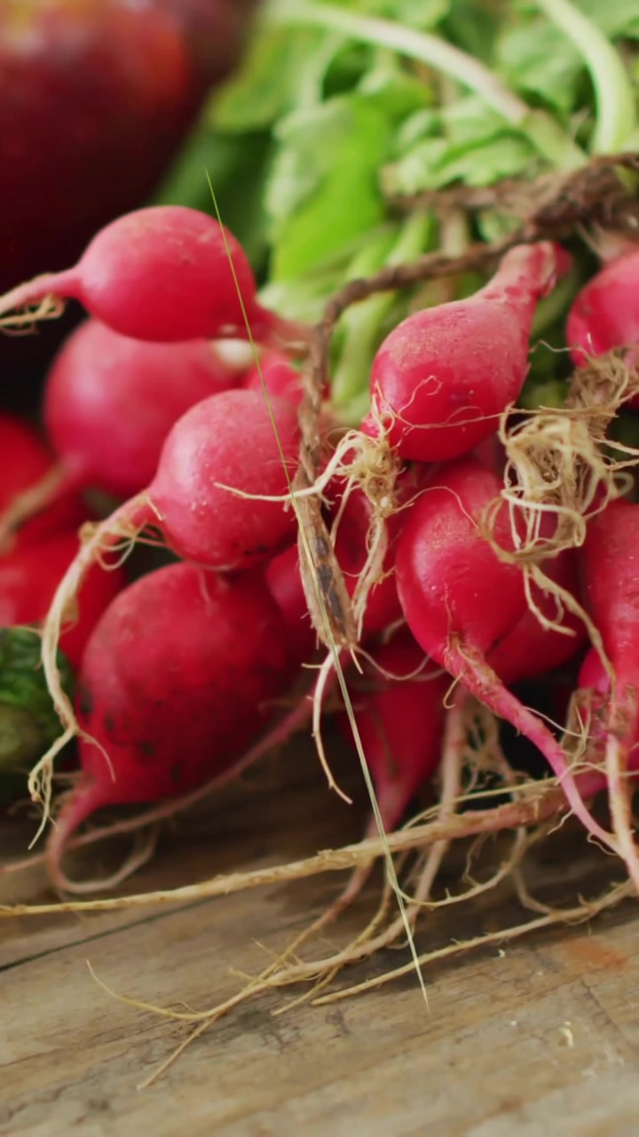Super Foods text animation over fresh vegetables on wooden surface