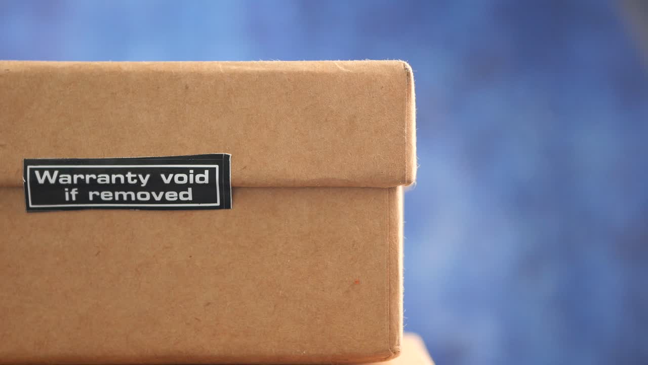 Warranty Void if Removed Label on Cardboard Box