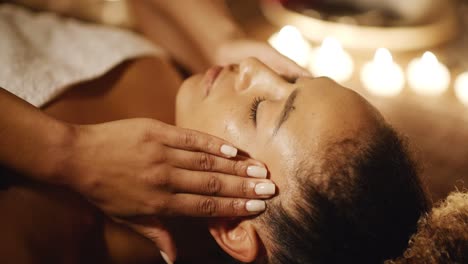 young woman massaging her face