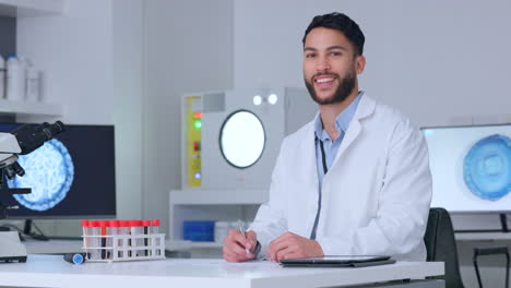 Male-scientist-writing-notes-while-doing-medical