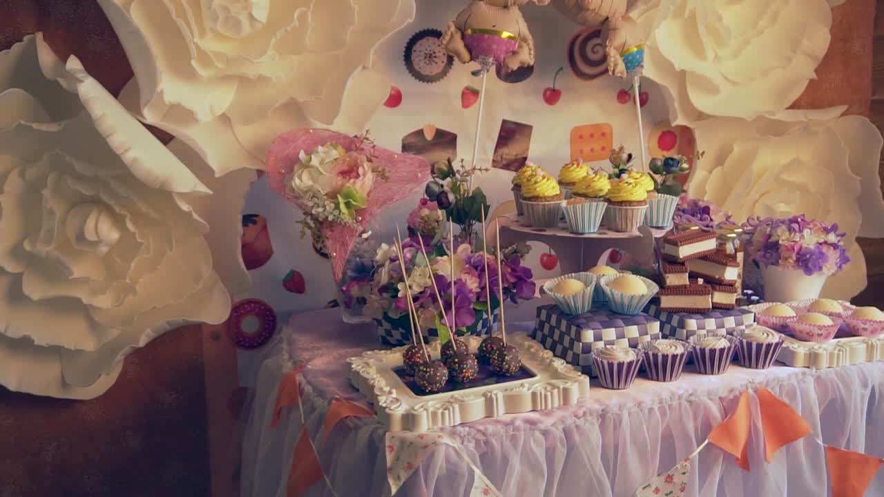 Sweet Dessert Table Decorated with Flowers