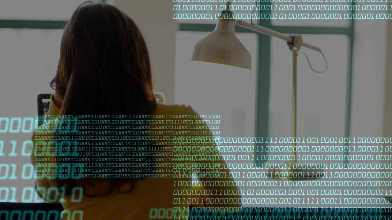 Woman on call tapping phone and checking tech data, binary overlay covering back and desk