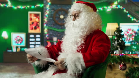 santa claus reading a christmas letter