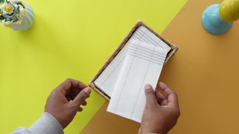 person holding a tissue box