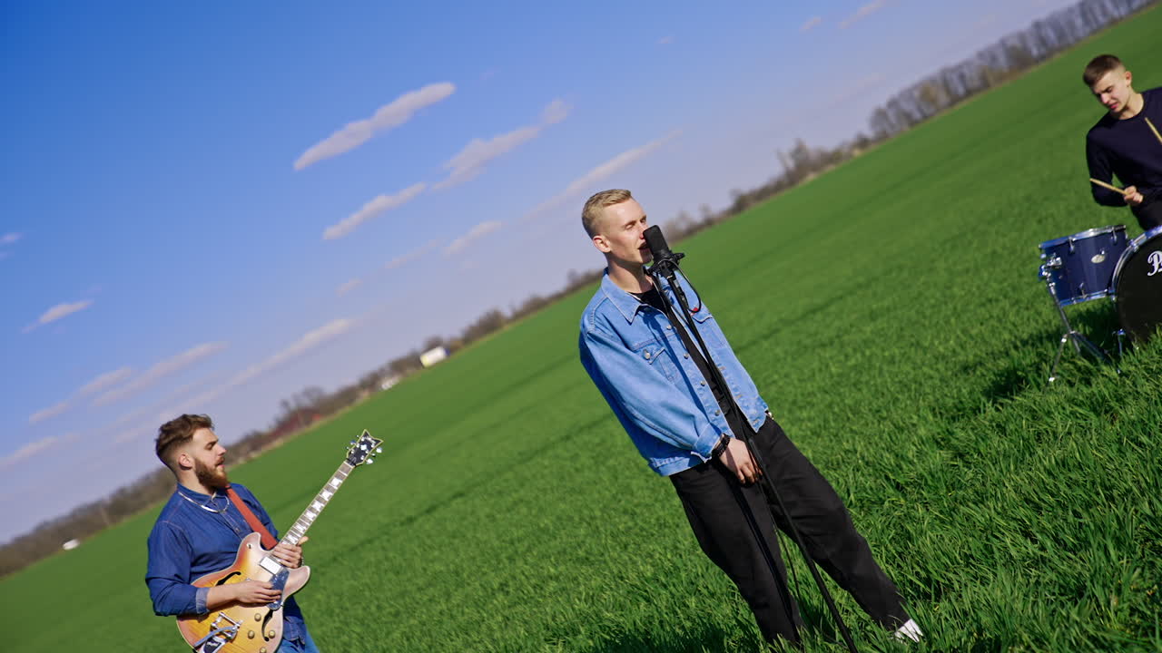 Band performing outdoors in a field