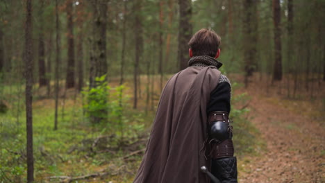 knight-in-armor-walks-through-forest