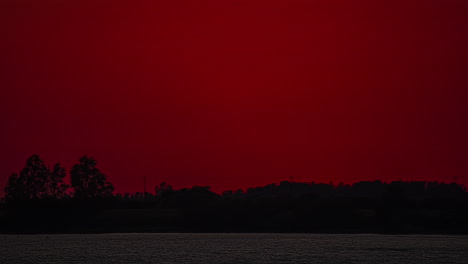 glowing fiery sun setting over paphos, cyprus - zoomed in time lapse