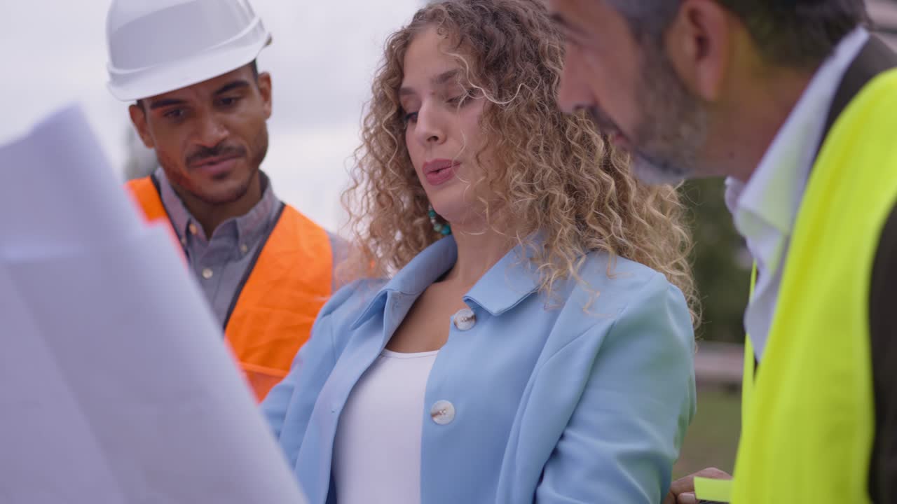 Construction Workers Reviewing Blueprint