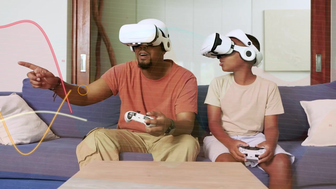 Padre che usa un tablet e indica, il figlio guarda, mentre indossa visori VR con nastri fluttuanti per il gaming.