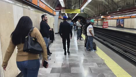 people waiting at a subway station in mexico city