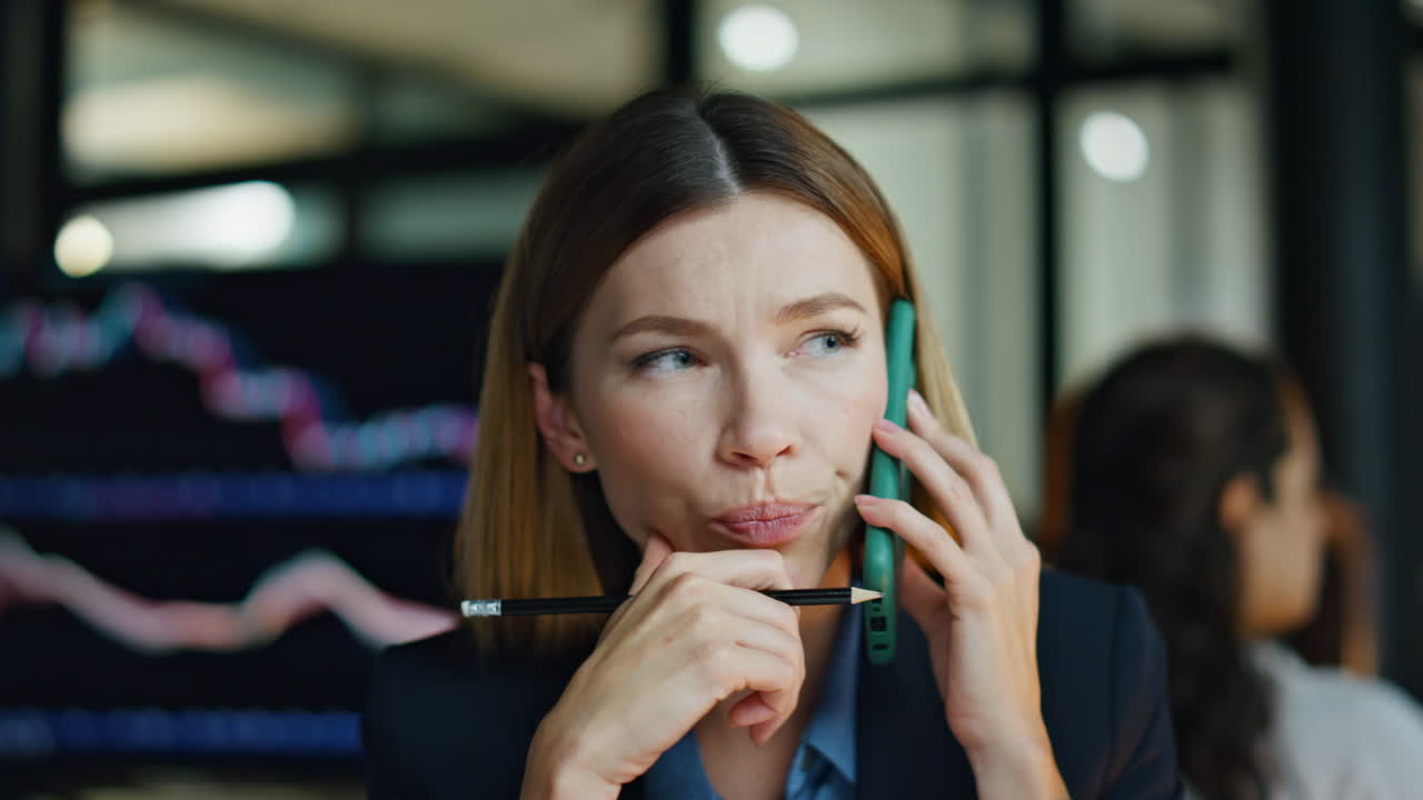 Investment manager talking smartphone closeup. Pensive businesswoman consulting