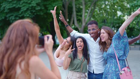 friends having fun posing for photos outdoors