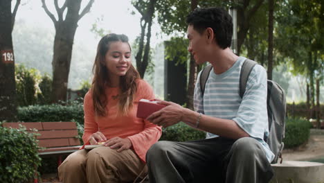 boy giving present to girl