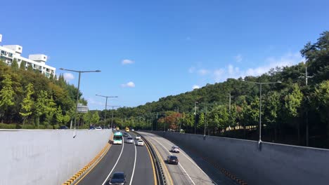 cars pass in seongnam, bundang, gyeonggi-do, south korea